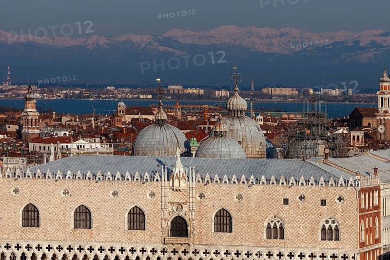 Doge's Palace and domes of St. Mark's Basilica in front of the snow-capped Alps, Venice, Veneto, Italy