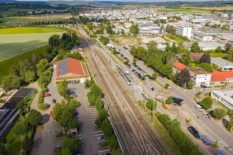 A general view shows rails, buildings and a city surrounded by green countryside, inauguration of the Hermann Hesse Railway extension, Renningen, Böblingen district, Germany