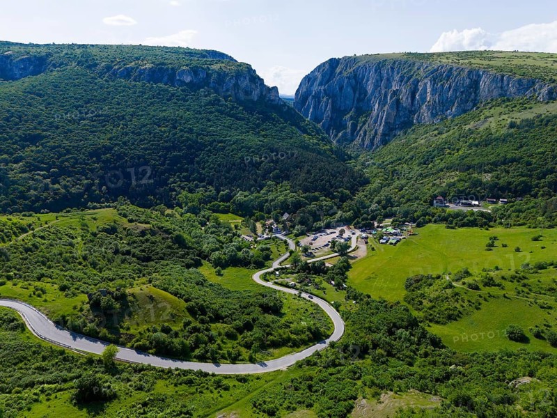 Picturesque valley with winding road surrounded by hills and rocks, aerial view, Cheile Turzii, Turda Gorge, Thorenburg Gorge, Turda, limestone gorge in the Trascau Mountains, Trascau, nature reserve, Western Carpathians, Transylvania, Romania