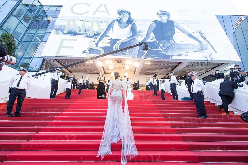 Woman in a long glittering dress walks up the stairs at the opening gala and premiere of La Vénus Électrique (The Electric Kiss) on the red carpet of the Palais des Festivals et des Congrès during the 79th Cannes International Film Festival. The 79th Cannes International Film Festival will take place from 12 to 23 May 2026