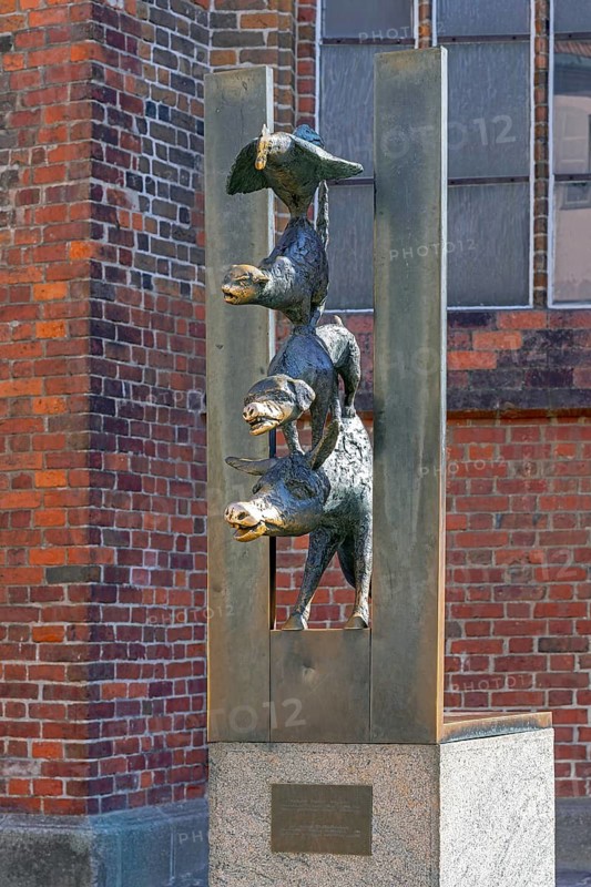 Bronze sculpture Town Musicians of Bremen by Christa Baumgärtel, German fairy tale by the Brothers Grimm in the Old Town of capital city Riga, Latvia