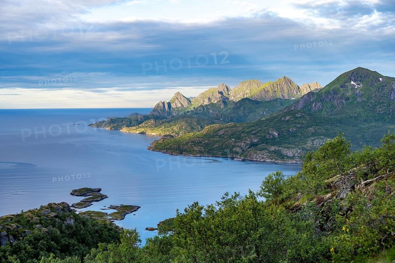 Mountain peaks in morning light by the sea, view from the hiking trail to the summit of Keiservarden or Digermulkollen, Vesterålen, Norway