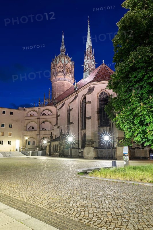 Atmospheric night view, courtyard of the castle with castle church and church tower, Luther city Wittenberg, Saxony-Anhalt, Germany