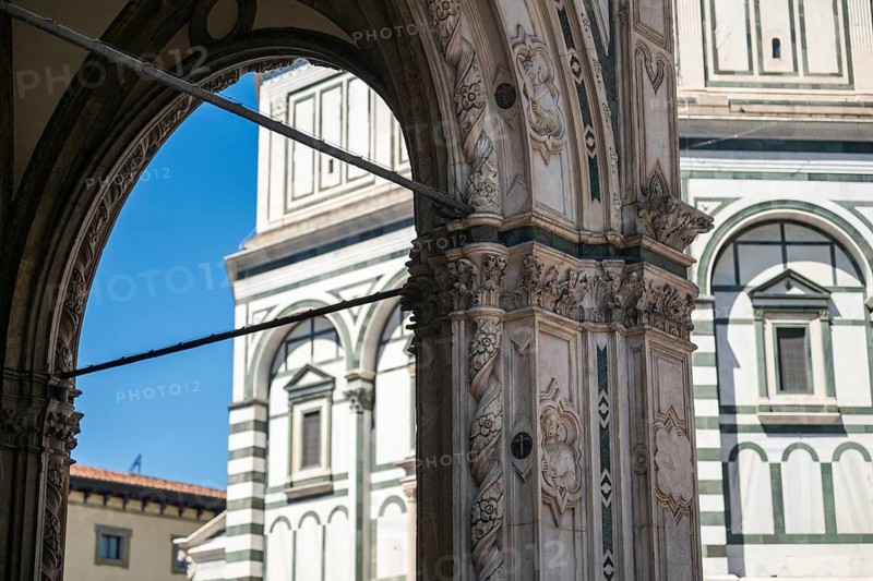 View through an ornate marble arch of the Baptistery of San Giovanni, baptistery, UNESCO World Heritage Site, old town, Florence, Tuscany, Italy