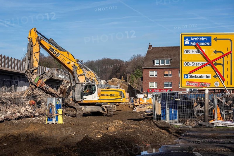 Demolition of the 120 meter long motorway bridge of the A516, across Teutoburger Straße in Oberhausen-Sterkrade, the bridge, built in 1970 was severely damaged, traffic continues to roll on the still existing West Bridge, after the demolition, the eastern part is rebuilt using a process unique in the world, 40 meter long precast concrete beams are assembled one after the other, reducing the construction period from 24 to 7 months after the completion of this bridge Will the western part also be rebuilt, North Rhine-Westphalia, Germany