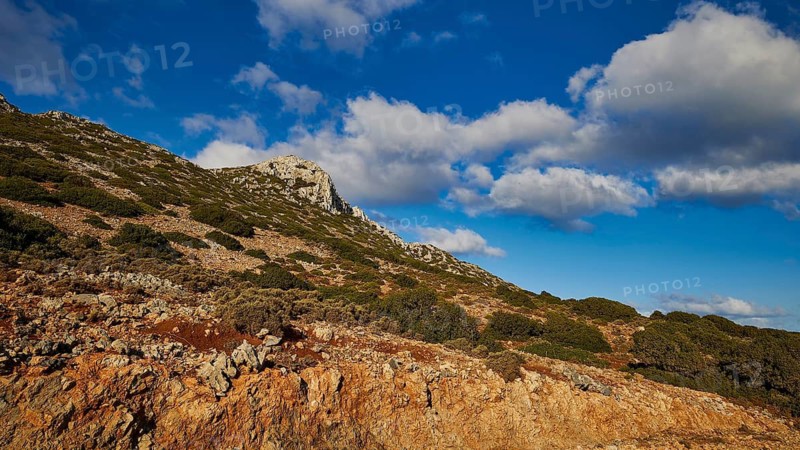 Morning light, hilly landscape with rocky background and blue sky with clouds, Rodopou Peninsula, Rodopou, West Crete, Greek Islands, Greece