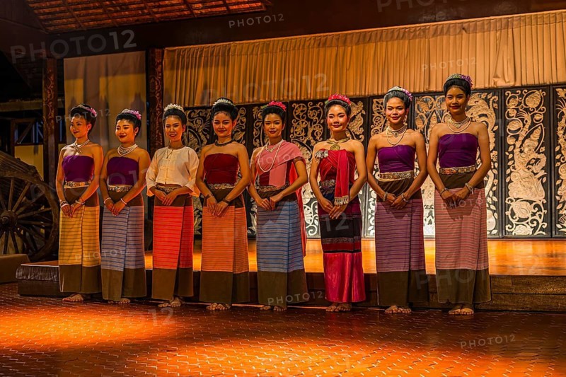 A dance group of young Thai women says their goodbyes to the audience, Old Chiang Mai Cultural Center, Chiang Mai, Thailand