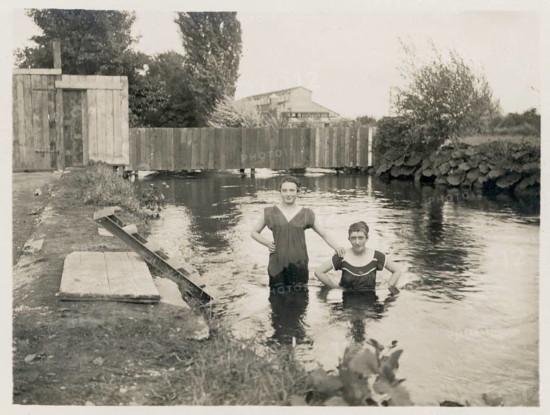 Colmar, Alsace Lorraine, France, outdoor pool, bathing, swimwear, leisure, summer, swimming, woman, men, A couple standing in the shallow water of a river enjoying the moment, around 1918