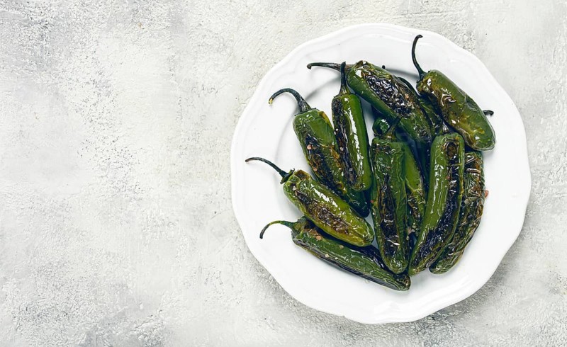 Fried padron pepper, in a frying pan, with olive oil, and sea salt, homemade, no people