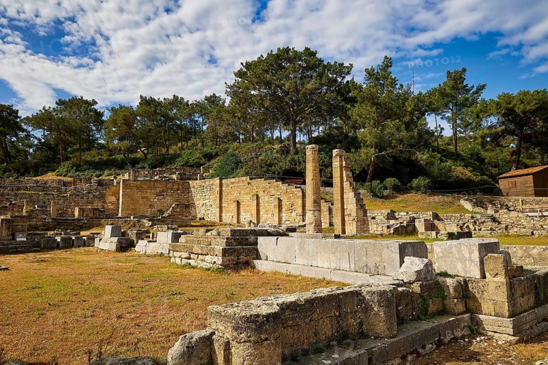 Ancient ruins with columns and stone walls in sunny weather with trees in the background, Kamiros, Temple of Apollo, Archaeological site, Ancient city, Foundation of Doric Greeks, Rhodes, Dodecanese, Greek Islands, Greece