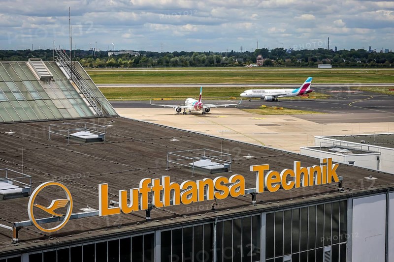 Düsseldorf, North Rhine-Westphalia, Germany, Lufthansa Technik LHT building at Düsseldorf Airport, MRO services, maintenance, repair and overhaul, maintenance, repair and overhaul, Eurowings aircraft in the back on the day of the warning strike by Lufthansa ground staff