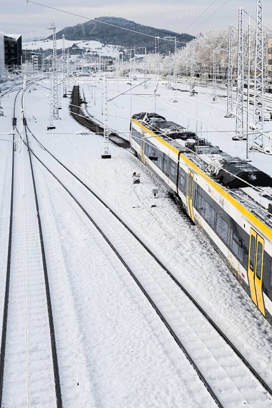 Tracks and train covered with snow and ice, Freiburg im Breisgau, Black Forest, Baden-Württemberg, Germany