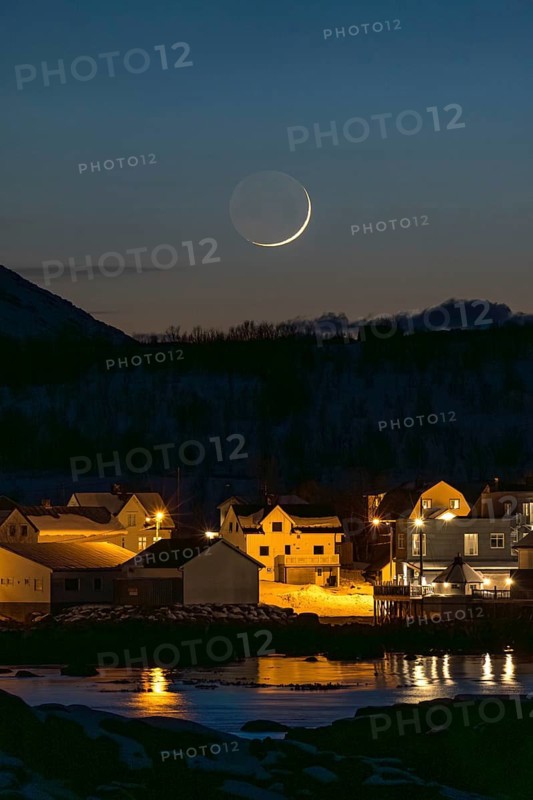 A serene nordic village is bathed in the soft ashen light under a crescent moon. The calm water reflects the moon glow, creating a beautiful and tranquil night scene
