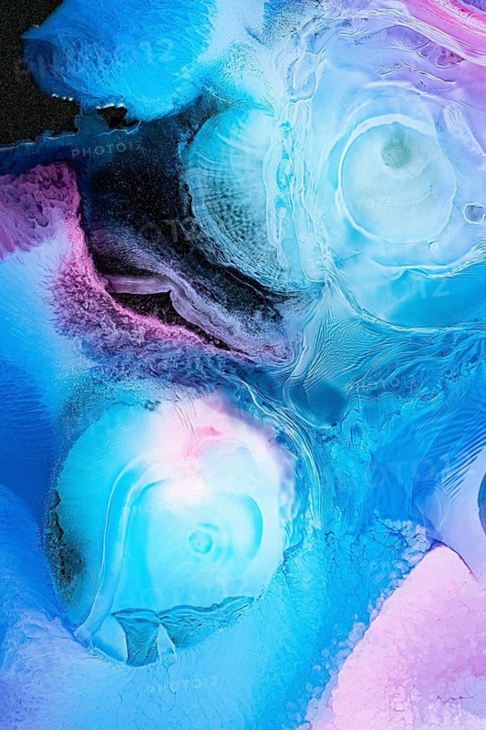 A stunning abstract composition featuring galactic patterns of blue and purple hues. This fluid watercolor art evokes a sense of movement in the galaxy