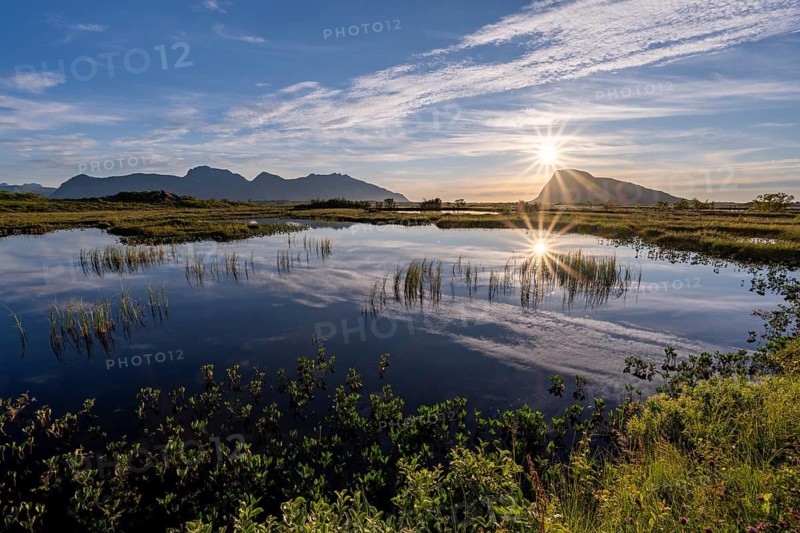 Pond with mountains at sunset, view of Mount Hoven, Gimsoy, Lofoten, Norway