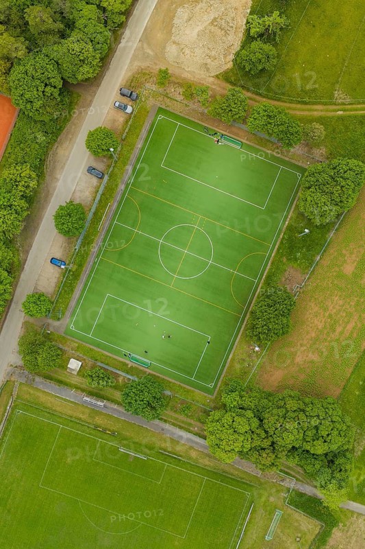 Aerial view of a soccer field with surrounding trees and roads, Aidlingen sports field, Böblingen district, Germany