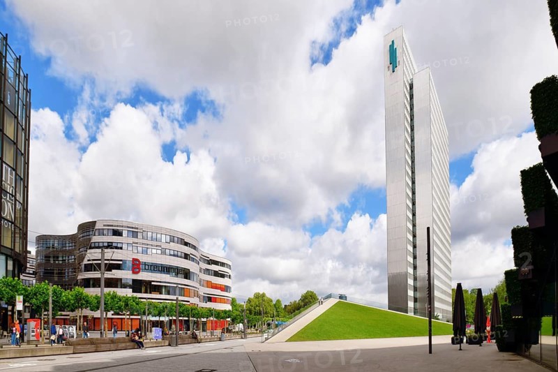 Düsseldorf, Germany - June 9th 2026: Joachim-Erwin-Platz with 'Breuninger' department store and modernist high rise office buildingin 'Dreischeibenhaus' in city center