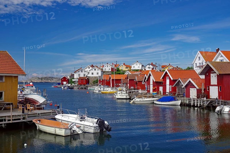 The small harbour of the archipelago island Gullhomen and small fishermen and leisure boats, holiday, Örust municipality, Sweden