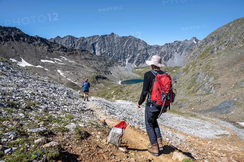 Hiker on a hiking trail in the Hohe Tauern, Austria