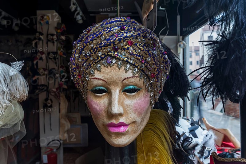Venetian carnival mask in a shop window, Venice, Veneto, Italy