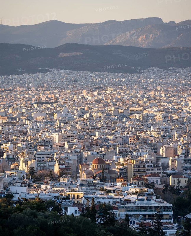 View over houses of Athens in the evening light, Athens, Attica, Greece