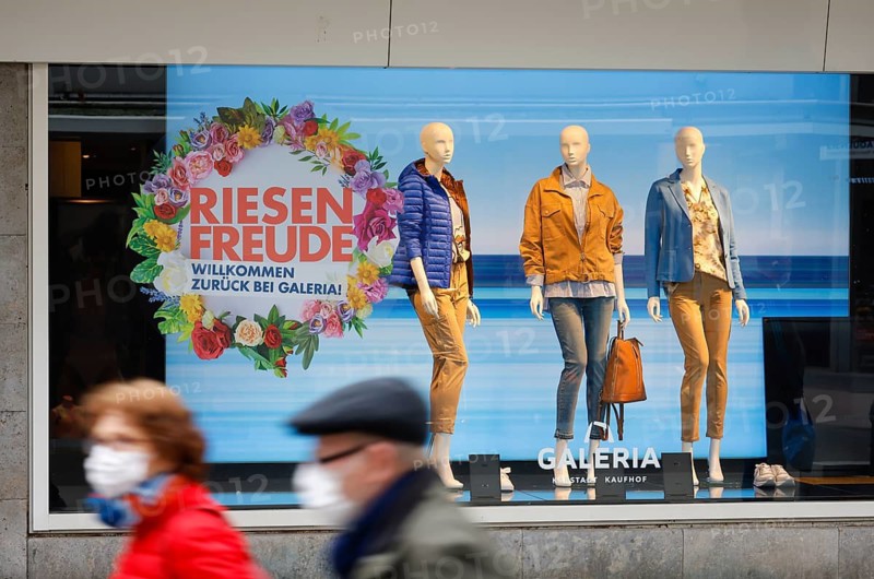 Düren, North Rhine-Westphalia, Germany - Düren city centre in times of the corona crisis during the second lockdown, most shops are closed, few passers-by in the pedestrian zone, Galeria Kaufhof Karstadt advertises Click & Meet in the shop window, register online and arrange a shopping appointment