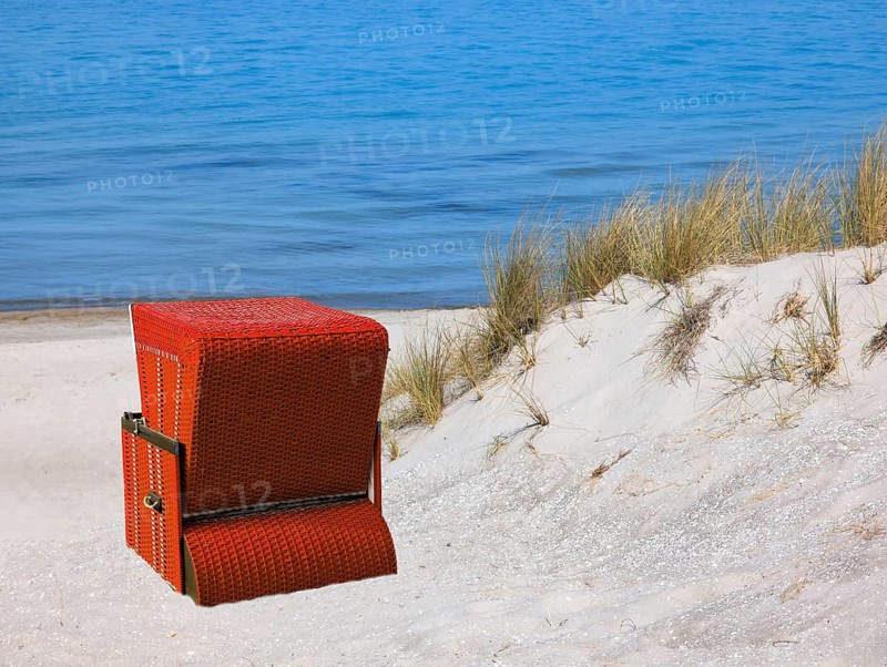 Red beach chair on the beach at the dunes