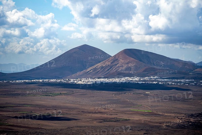 Volcanic crater and volcanic landscape with fields and villages, Lanzarote, Canary Islands, Spain