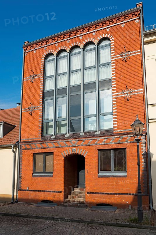 Historic building with brick façade and large windows under a clear sky, old town island of Werder in der Havel, Potsdam-Mittelmark, Brandenburg, Germany