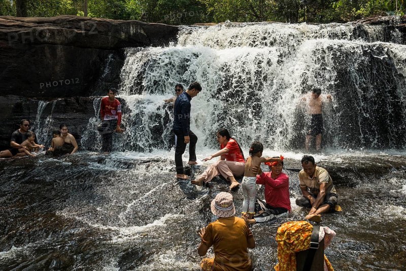 Kulen waterfall with bathing people, Phnom Kulen National Park, Siem Reap, Cambodia