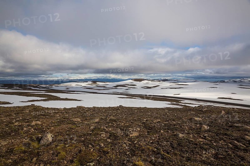 Snowfields at the Heidarvatn lake between Seydisfjördur and Eglisstadur in E Iceland