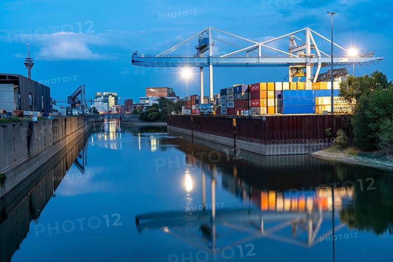 Port facilities, container terminal of DCH Düsseldorfer Container Hafen GmbH, Neuer Zollhof building complex, the Gehry buildings, at the Media Harbour, behind the Stadttor building, Düsseldorf, North Rhine-Westphalia, Germany