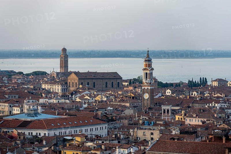 View over the roofs of Venice to the steeple of the church Chiesa Parrocchiale dei Santi Apostoli, view from the bell tower Campanile di San Marco, city view of Venice, Veneto, Italy