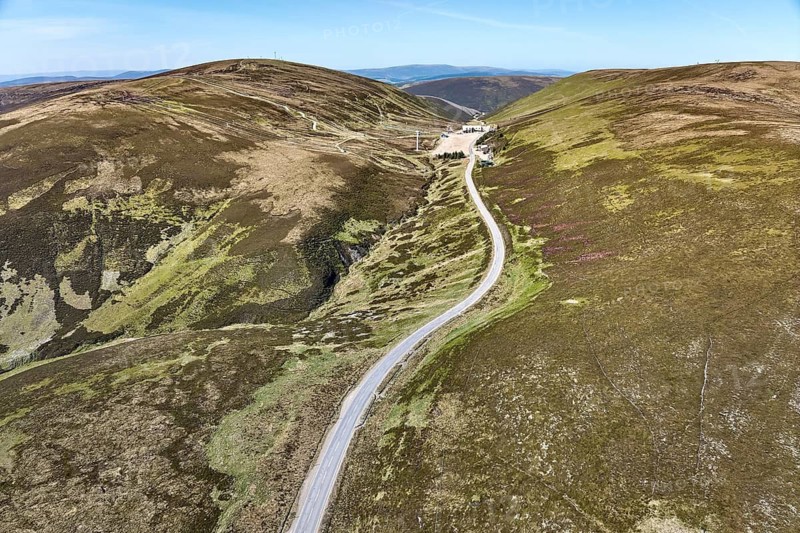 Aerial drone view of the highland landscape with skiing and outdoor sports station above Braemar, Cairn Gorm National Park, Scotland, UK