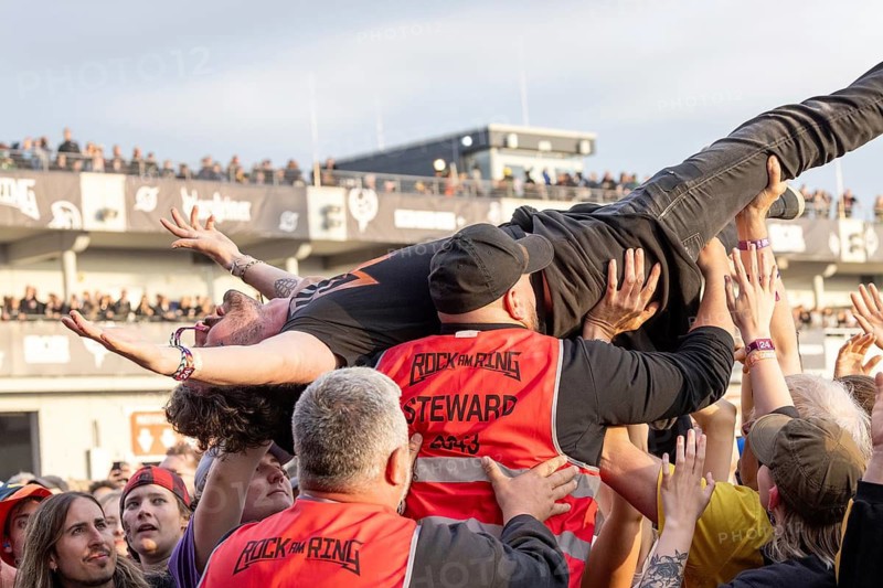 Adenau, Germany, 8 June 2024: Fans crowdsurfing and listening to Billy Talent at Rock am Ring. The festival takes place at the Nürburgring race track near the town of Adenau from 7 - 9 June 2024