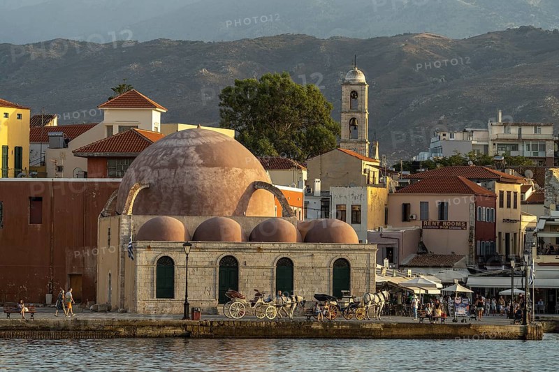 The Hasan Pasha Mosque and the old town at the old Venetian harbour, Chania, Crete, Greece