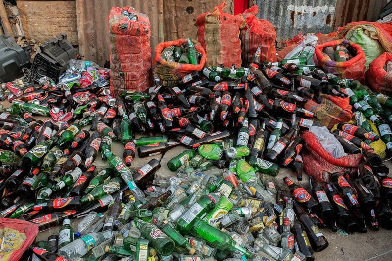 Heap of empty bottles of alcohol intended to be recycled India
