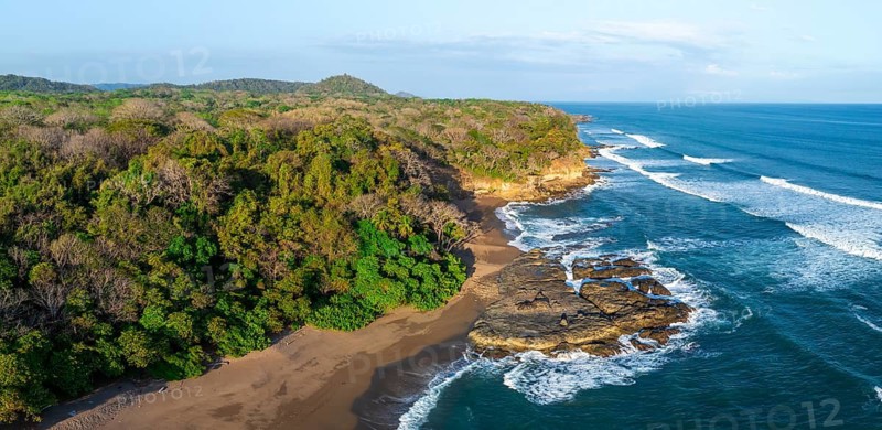 Aerial view, rainforest, sandy beach and coast with waves, Playa Cocalito, Puntarenas, Costa Rica