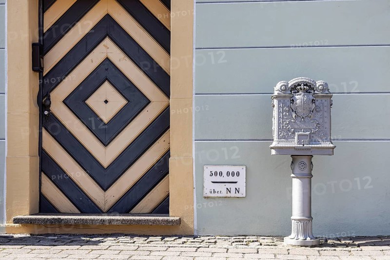 Town hall of the municipality of Königsbronn, built in 1765 in the rococo style. Height mark 500 metres above sea level. Historic post box. Königsbronn, Baden-Württemberg, Germany