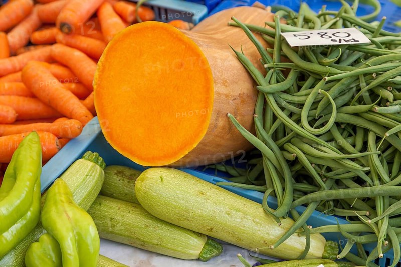 Fresh vegetables on a market stand with carrots, squash, green beans and zucchini, Majorca, Balearic Islands, Spain