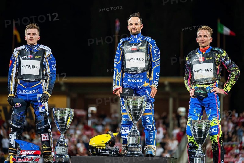WROCLAW, POLAND - JUNE 20, 2026: DEWALT FIM Speedway GP of Poland. Speedway riders celebrating victory with trophy after race. Joy winnersylwetka silhouette 2. Robert Lambert 1. Bartosz Zmarzlik 3. Michael Jepsen Jensen