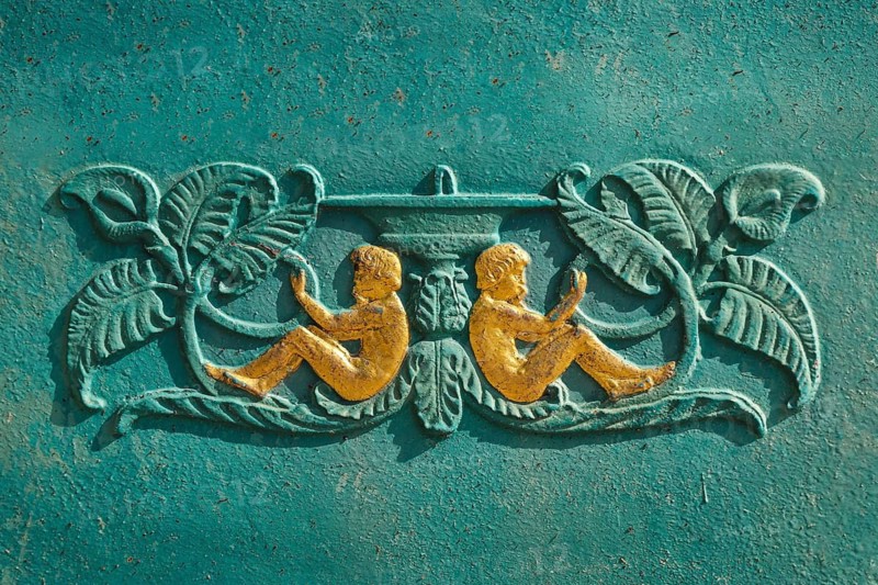 Fountain in front of the Protestant town church, green fountain, detail, relief, depiction of a fountain, youths, foliage, Rosenfeld, Zollernalb district, Baden-Württemberg, Germany