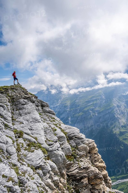 Mountaineers on Tanzbödeli summit in front of mountain landscape, Bernese Alps, Bernese Oberland, Switzerland