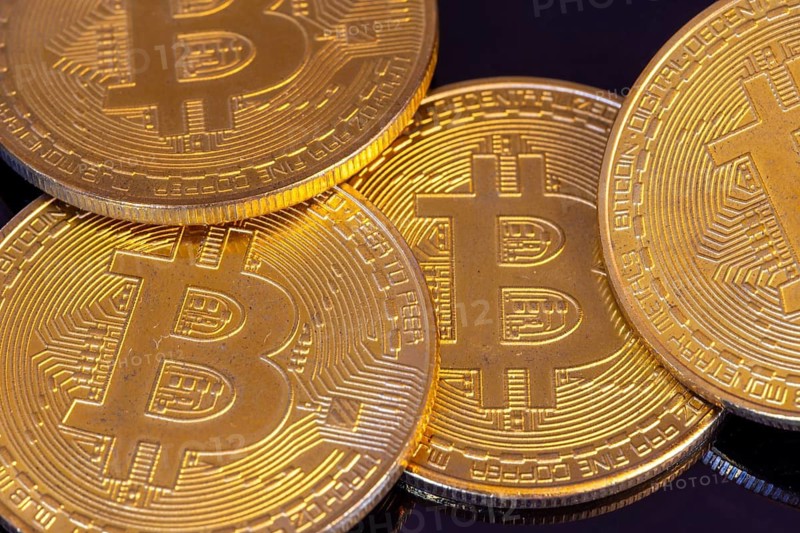 Close-up of symbolic bitcoins