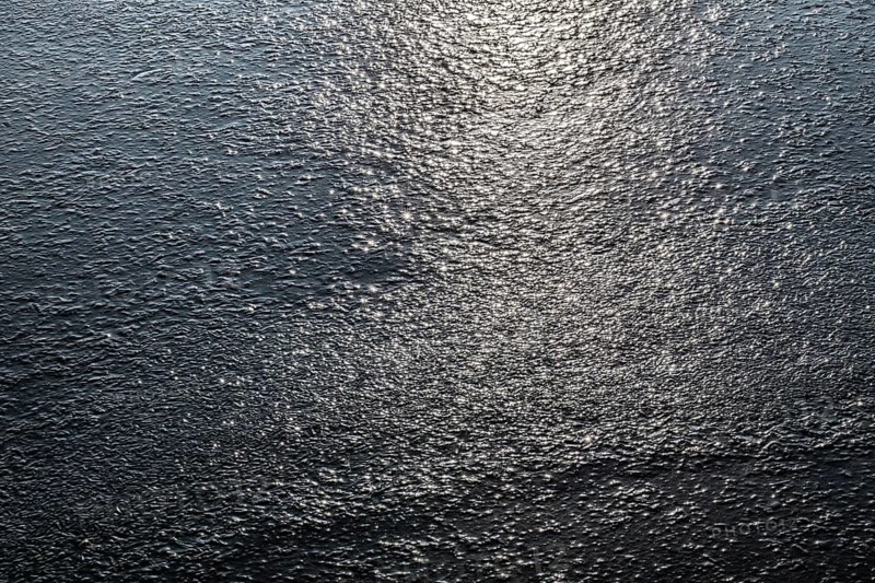 Frozen lake, structures of the water surface