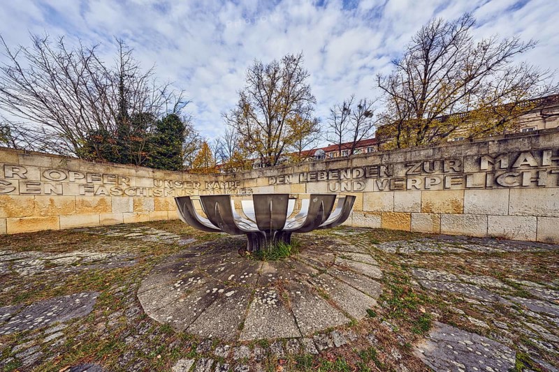 Memorial for anti-fascist resistance and against war, metal artists Joachim Fitzermann and Christian Röhl, architect Werner Berg, sandstone wall, fire bowl, Einheit Square park, general architecture, houses, trees, lawn, autumn leaves, blue sky, cumulus clouds, cirrostratus clouds, Potsdam, state capital, district-free city, Brandenburg, Germany