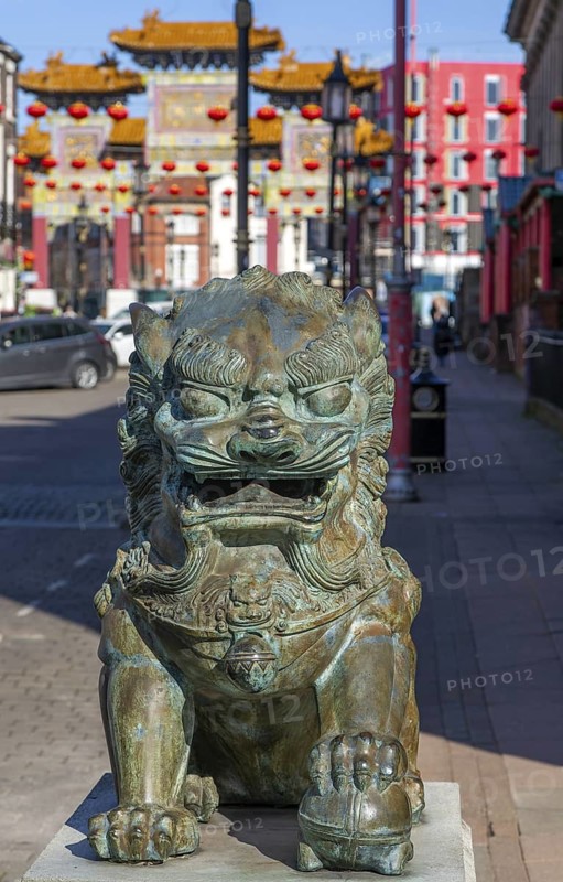Large Chinese brass lion in Chinatown, Nelson Street, Liverpool, Merseyside, England, UK