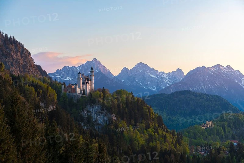 Wide view of Neuschwanstein Castle against an alpine backdrop, Schwangau near Füssen, Ostallgäu district, Swabia, Bavaria, Germany