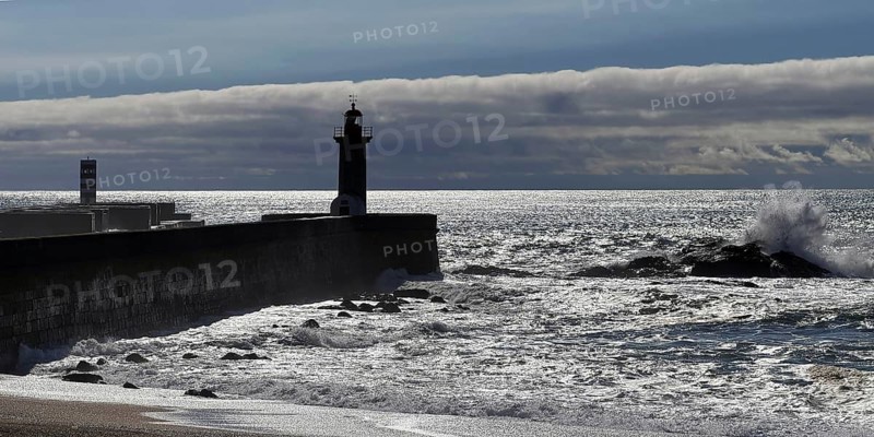 The Farolim da Barra do Douro and Farolim de Felgueiras lighthouses in the ocean surf on the Atlantic coast, Porto, Portugal