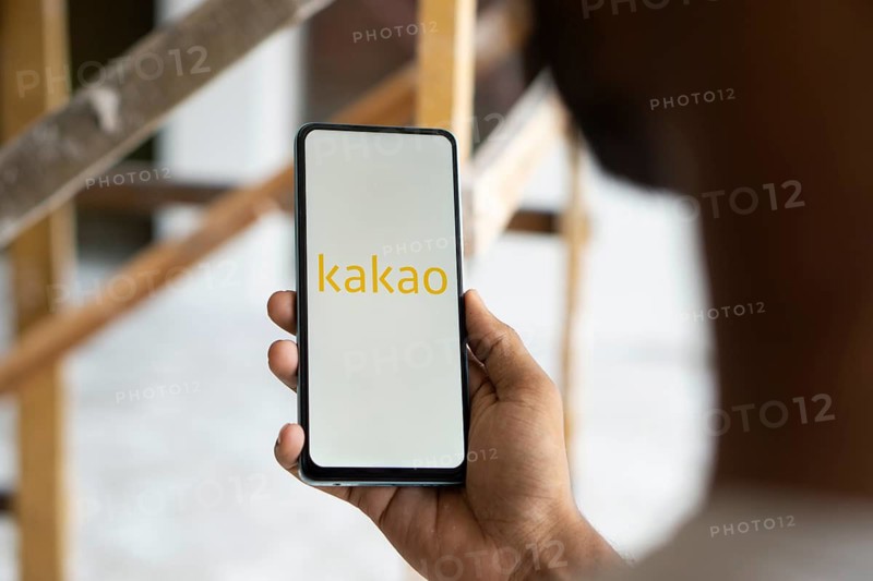 Kakao logo is displayed on smartphone.